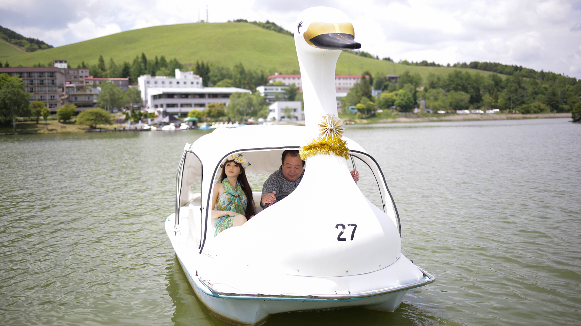 NAGANO, JAPAN - JUNE 5: Senji Nakajima enjoys boat on lake Suwa with his Love Doll "Saori" on June 5, 2016 in Nagano, Japan. Senji Nakajima, 61 years old, lives with his life-size 'love doll' named 'Saori' in his apartment in Tokyo, Japan. Nakajima, married with two children, who lives away from home for work, first started his life with Saori six years ago. At first, he used to imagine as if the doll was his first girl friend, and used it only for sexual purposes to fill the loneliness, but months later, he started to find Saori actually has an original personality. "She never betrays, not after only money. I'm tired of modern rational humans. They are heartless," Nakajima says, "for me, she is more than a doll. Not just a silicon rubber. She needs much help, but still is my perfect partner who shares precious moments with me and enriches my life." (Photo by Taro Karibe/Getty Images)