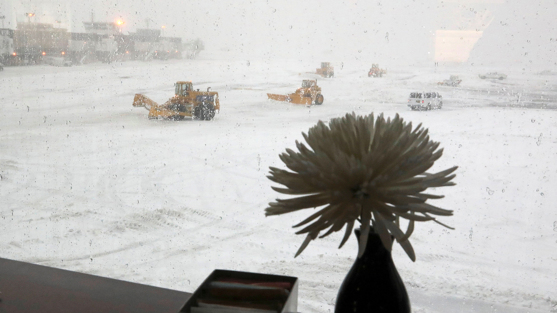 Snowplows clear the runway of snow at LaGuardia Airport in New York, U.S., March 14, 2017. REUTERS/Shannon Stapleton